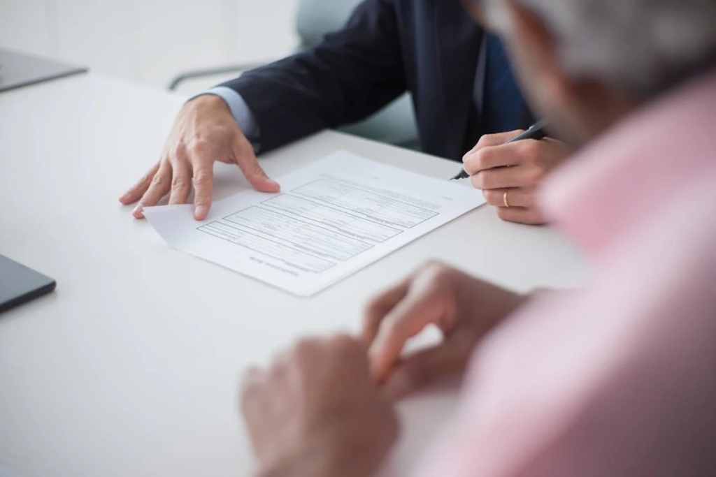 A man signing documents