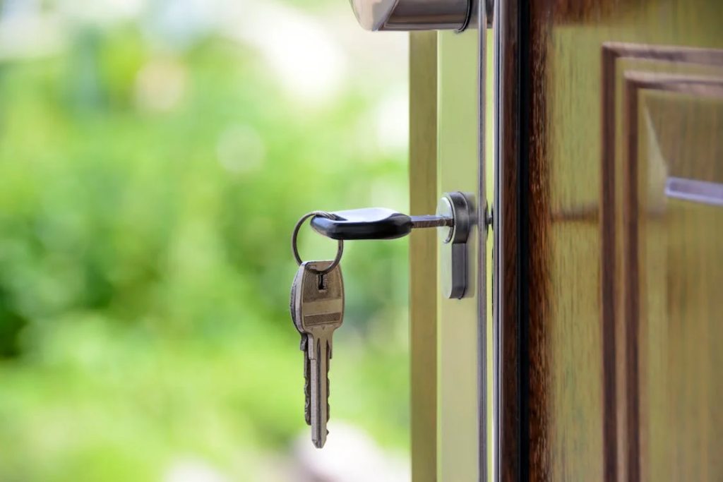 Keys unlocking a door