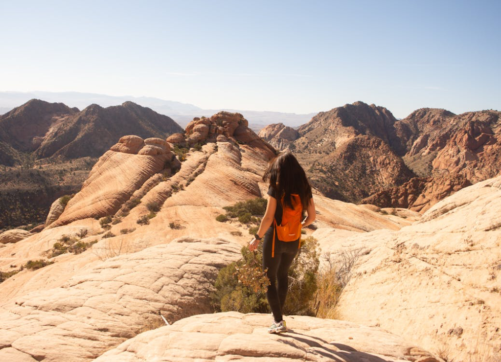 A woman taking a hike in St. George