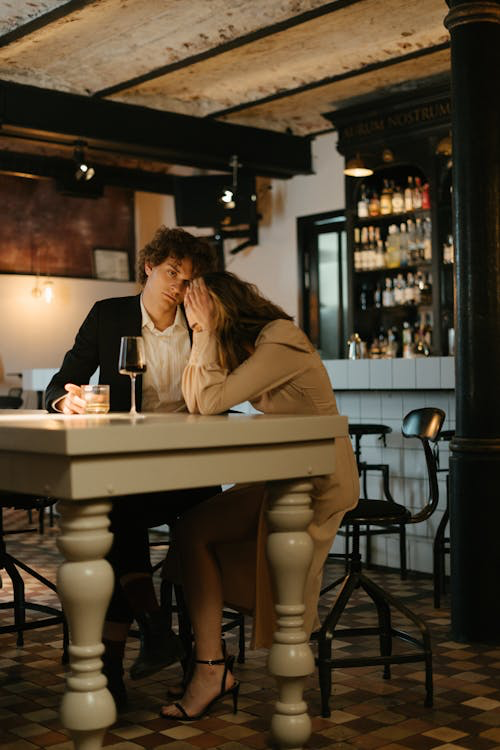 A man and woman sitting at a table