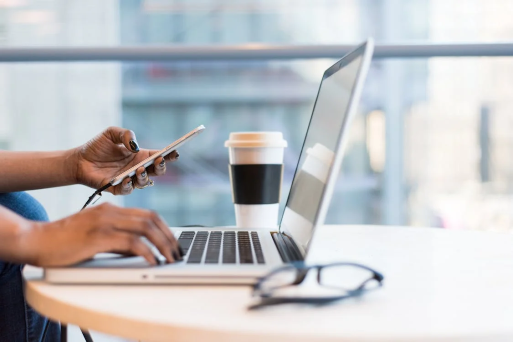 A person using a laptop on a table