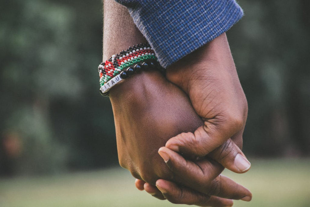 Two people holding hands