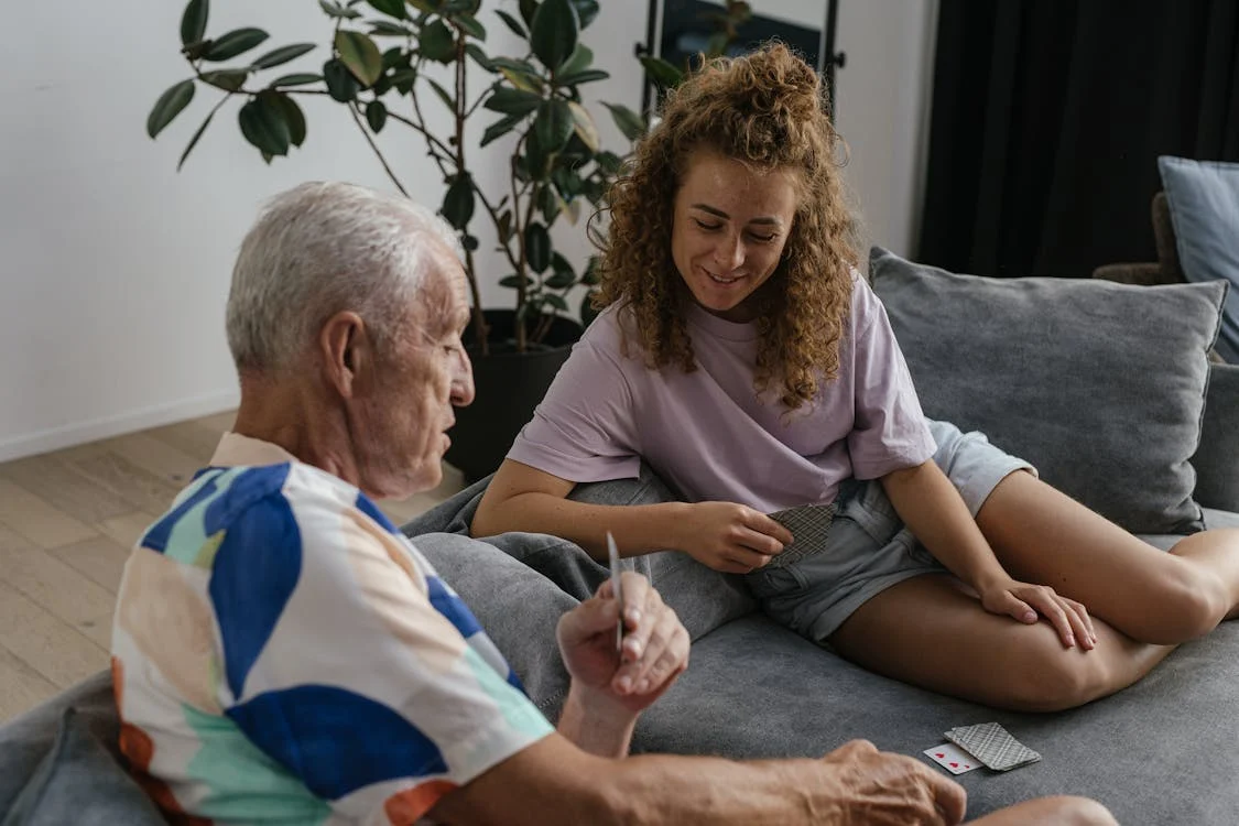 A man and woman playing cards together