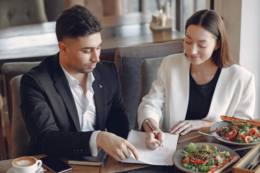 Two people looking over paperwork