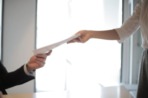 Two people passing off documents