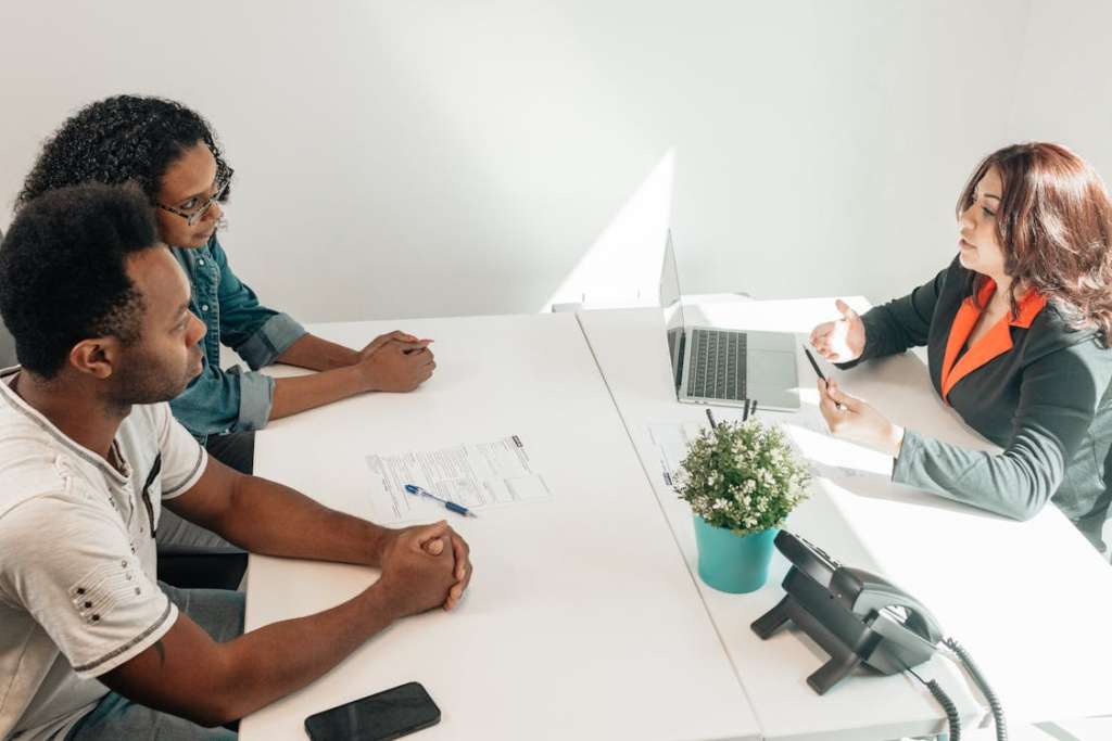 Three people having a meeting