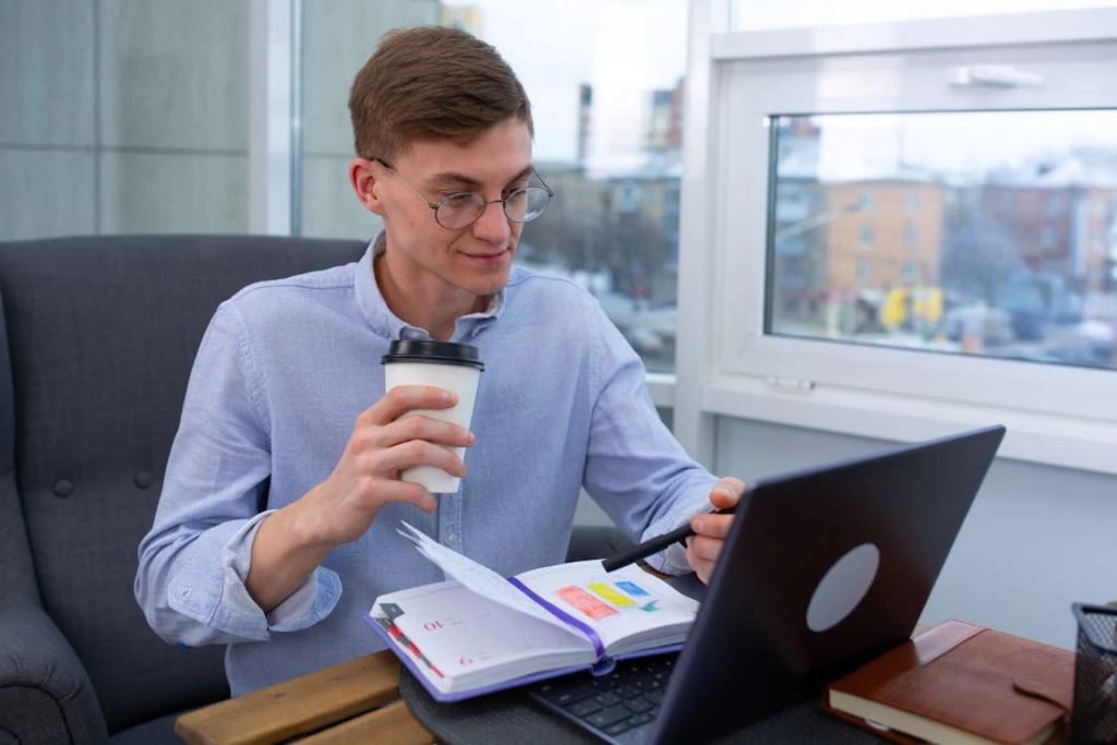 A man doing research on his laptop